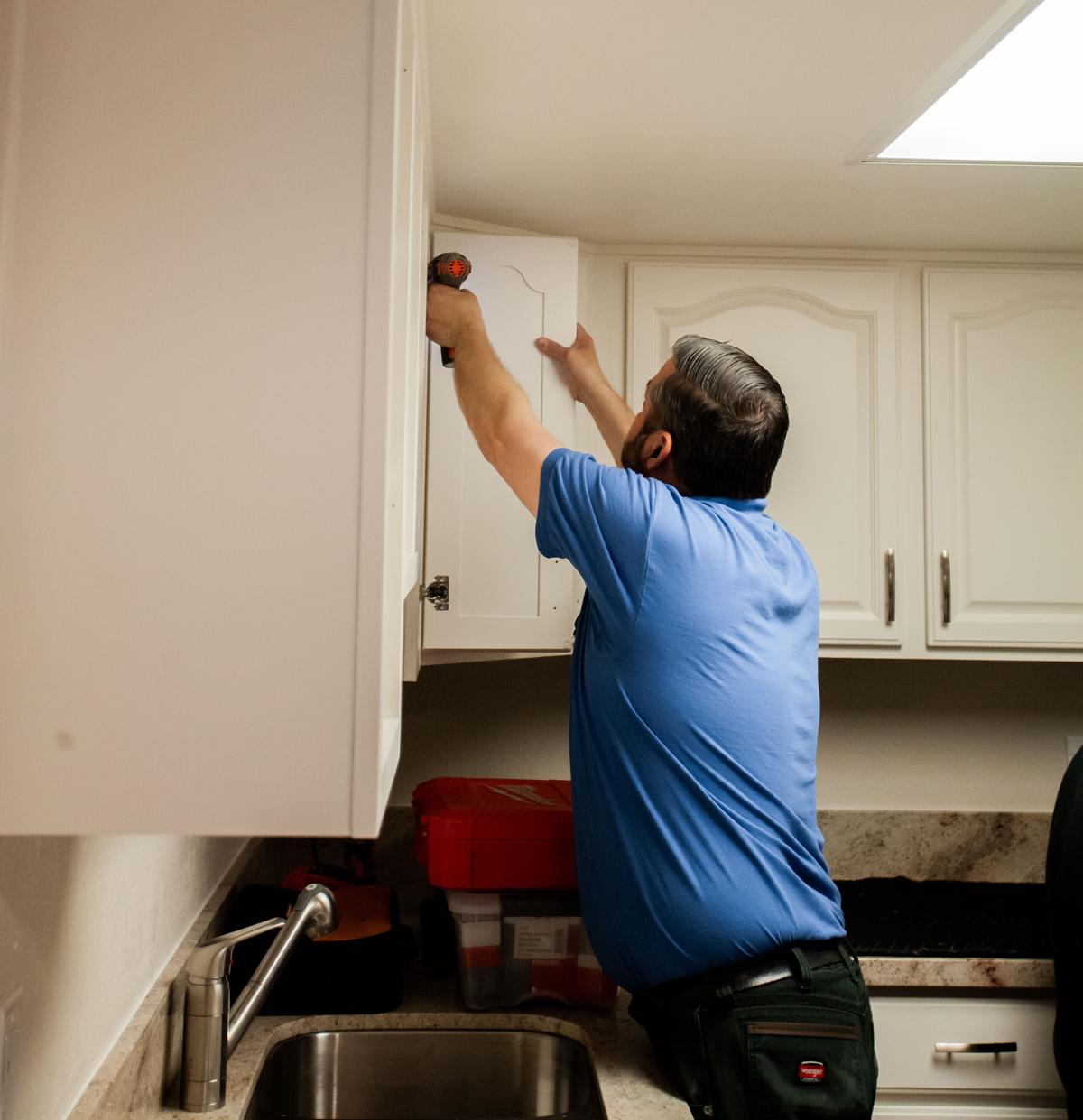 cabinet coatings technician install cabinet